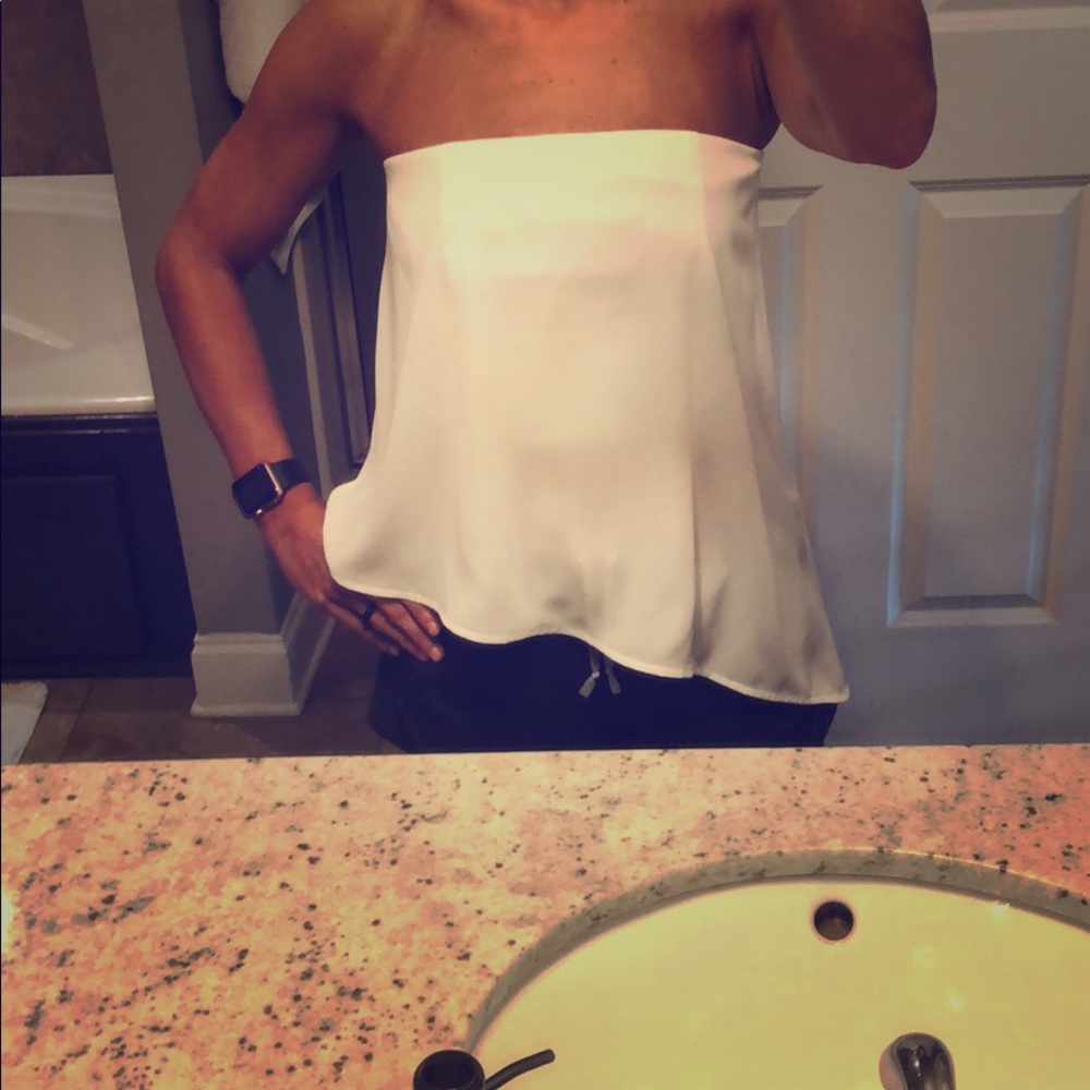 Sleeveless white flowy crop.